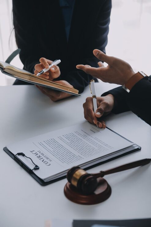 justice law concept legal counsel presents client signed contract with gavel legal law legal having team meeting law firm background_265022 79532